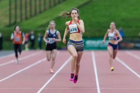 Image: Girl runner crossing the line at the firmus Super5 event