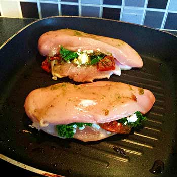 Image: hot pan on gas hob with chicken fillets
