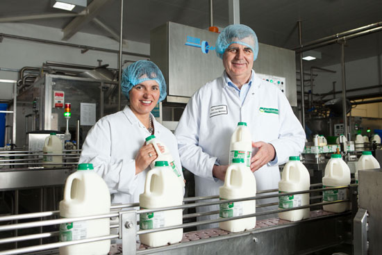 Image: firmus staff with Ballyrashane Creamery staff holding milk cartons