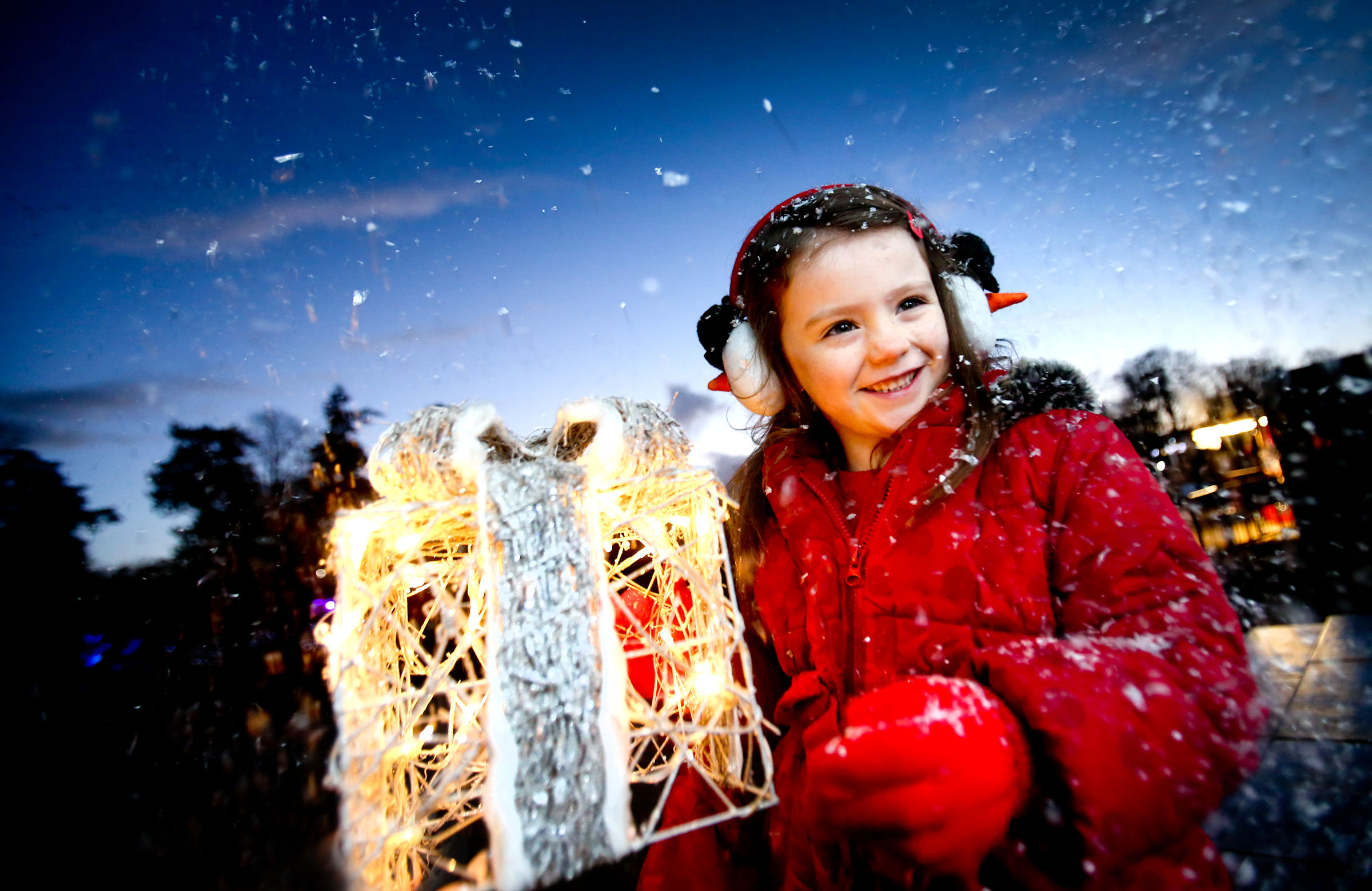 Image: Emily, age 5, helping firmus load toys for donation