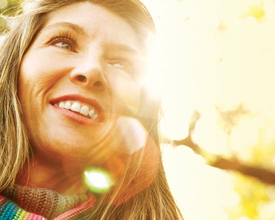 Image: girl in scarf enoying sunshine